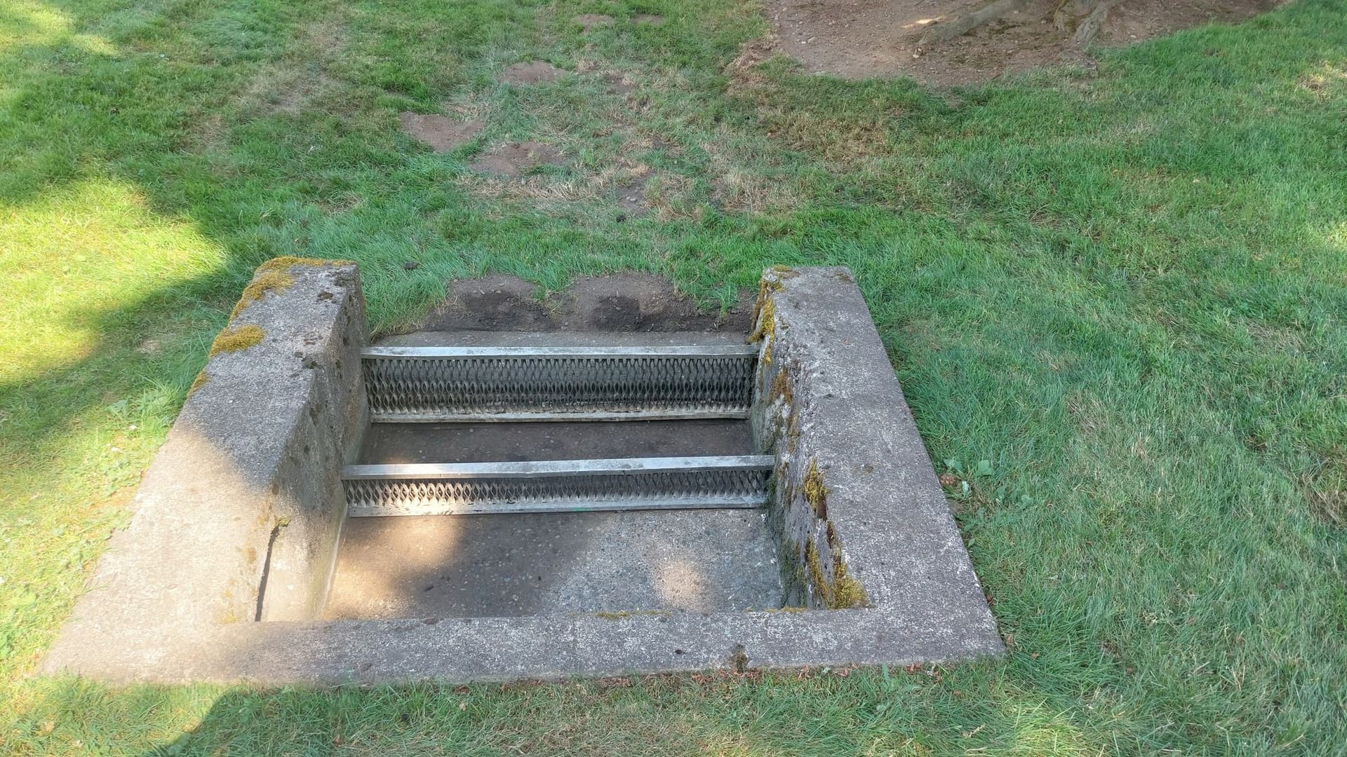 Completed trash rack maintenance showing clear water flow