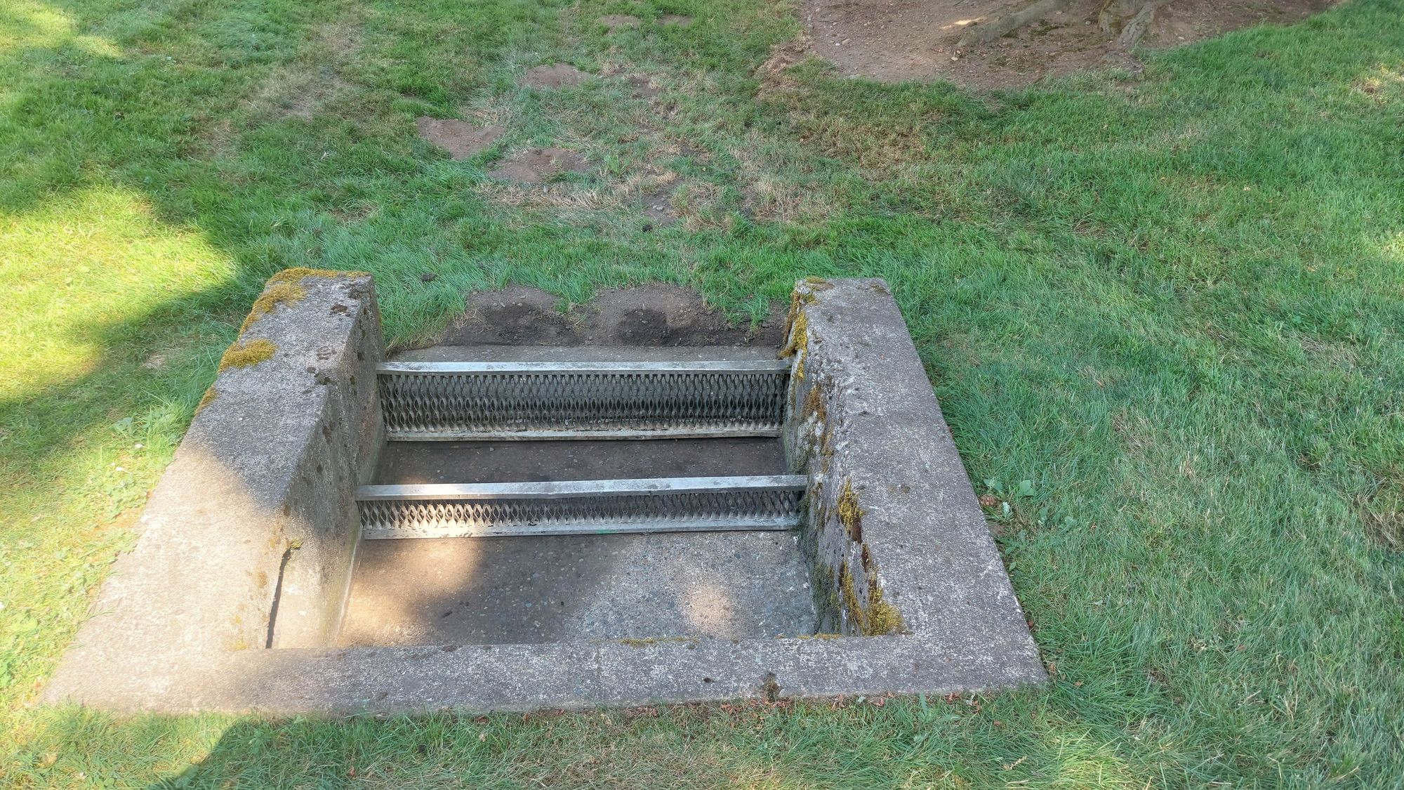 Completed trash rack maintenance showing clear water flow