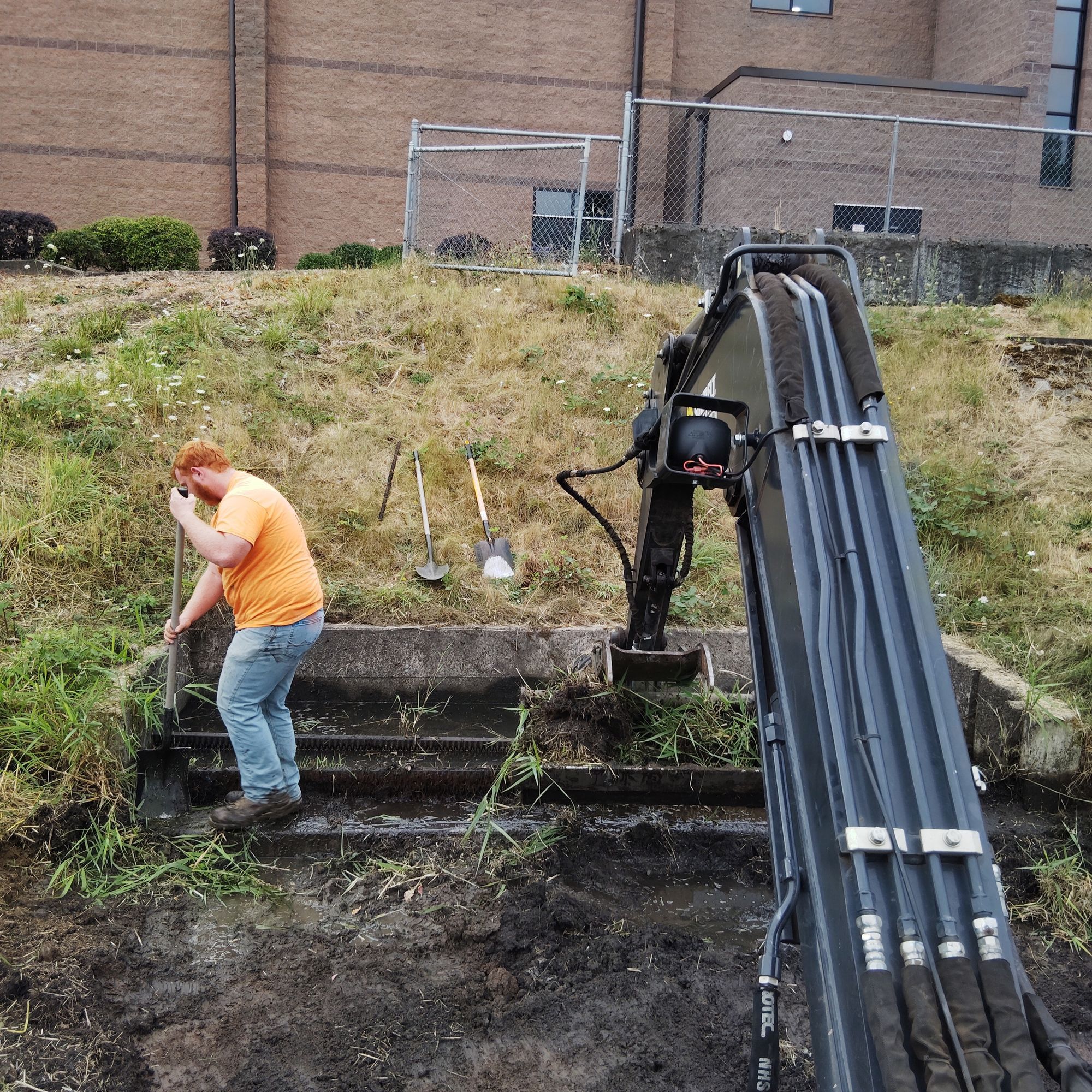 Crew performing trash rack maintenance
